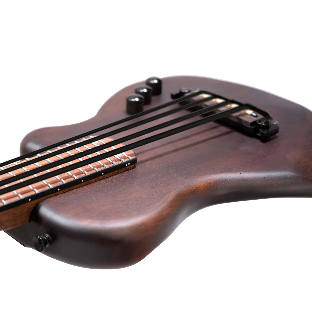 This lightweight, single-cutaway solid-body electric bass produces solid fundamental bass tone. Its specially-engineered bridge with long-throw adjustable string compensation enables you to change the scale length to suit the use of either polymer or steel strings. The piezo pickup with active (9v) EQ creates a BIG sound that goes anywhere! Controls for volume, treble boost, and bass boost. Padded gig bag included.