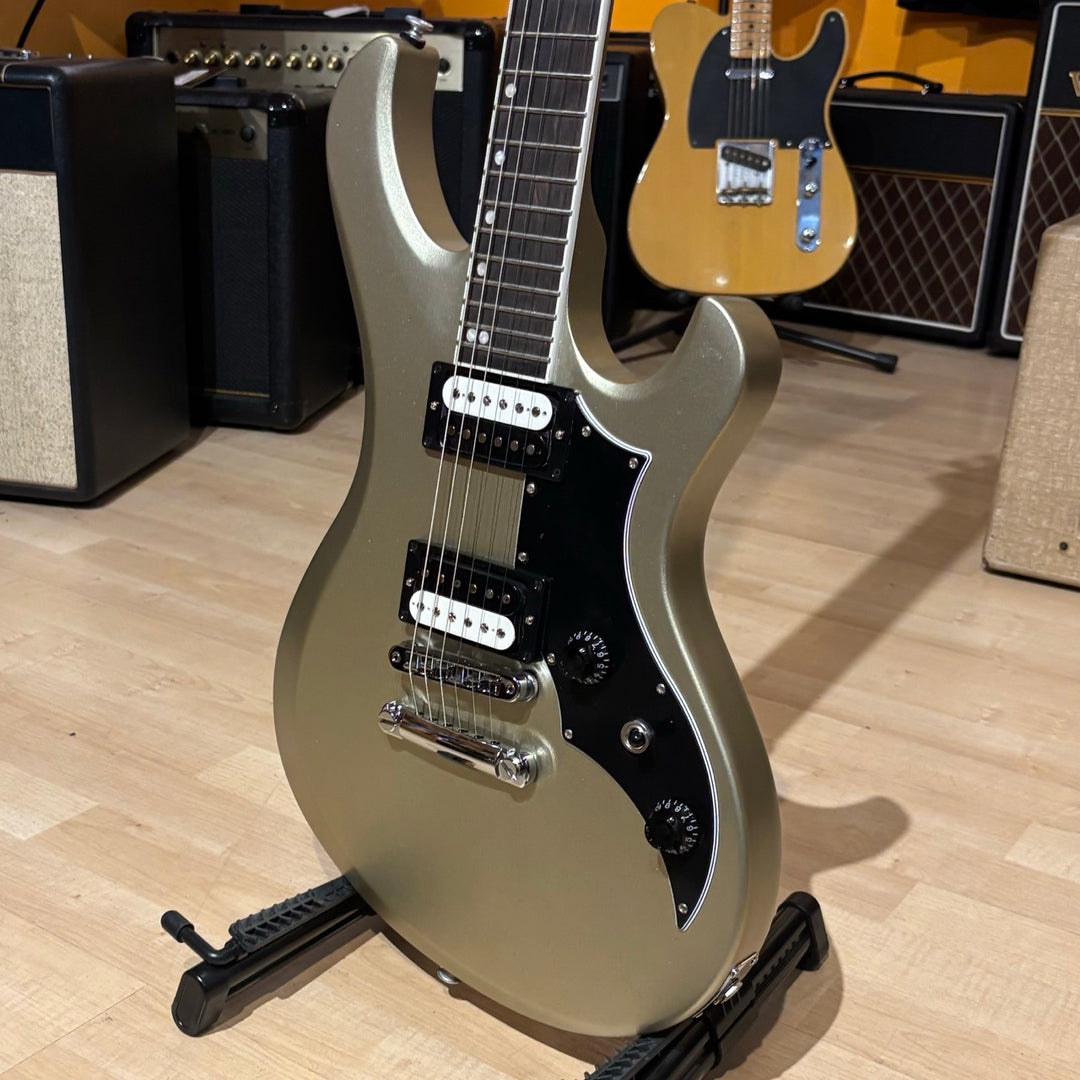 Gibson Victory, Gold Mist Satin. Reintroduced 80s-era cult-favorite solidbody electric. Mahogany body with refined contours. Explorer headstock. 25.5-inch scale SlimTaper mahogany neck, compound radius ebony fretboard, 24 medium jumbo frets. 80s Tribute humbuckers with push/pull master volume and tone controls for coil splitting. Tune-O-Matic bridge, Stop Bar tailpiece. Satin nitrocellulose lacquer finish. Includes hardshell case.