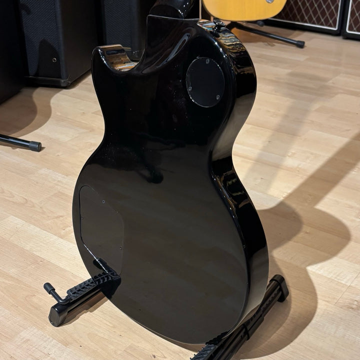 Gibson Les Paul Studio Modern. Ultra Modern weight-relieved mahogany body with maple cap. Modern Contoured Heel for exceptional upper-fret access. Mahogany neck with rounded profile. Compound radius bound ebony fretboard. 490R and 498T pickups with coil tapping, phase switching, and pure bypass. Black nickel hardware. Includes soft shell case.