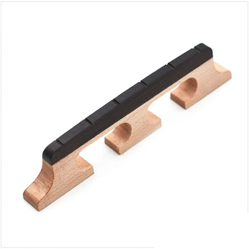 The Gold Tone 6-String Banjo Bridge boasts a construction featuring premium maple and ebony materials.
DETAILS:

Gold Tone bridge.
For 6-string banjo.
11/16 in.
Maple bridge with ebony top.