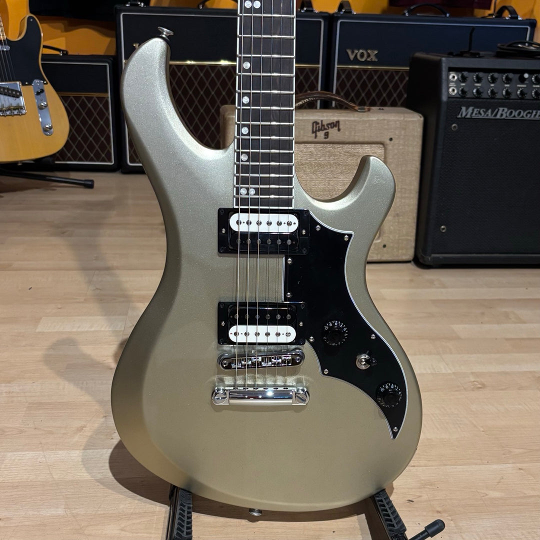Gibson Victory, Gold Mist Satin. Reintroduced 80s-era cult-favorite solidbody electric. Mahogany body with refined contours. Explorer headstock. 25.5-inch scale SlimTaper mahogany neck, compound radius ebony fretboard, 24 medium jumbo frets. 80s Tribute humbuckers with push/pull master volume and tone controls for coil splitting. Tune-O-Matic bridge, Stop Bar tailpiece. Satin nitrocellulose lacquer finish. Includes hardshell case.