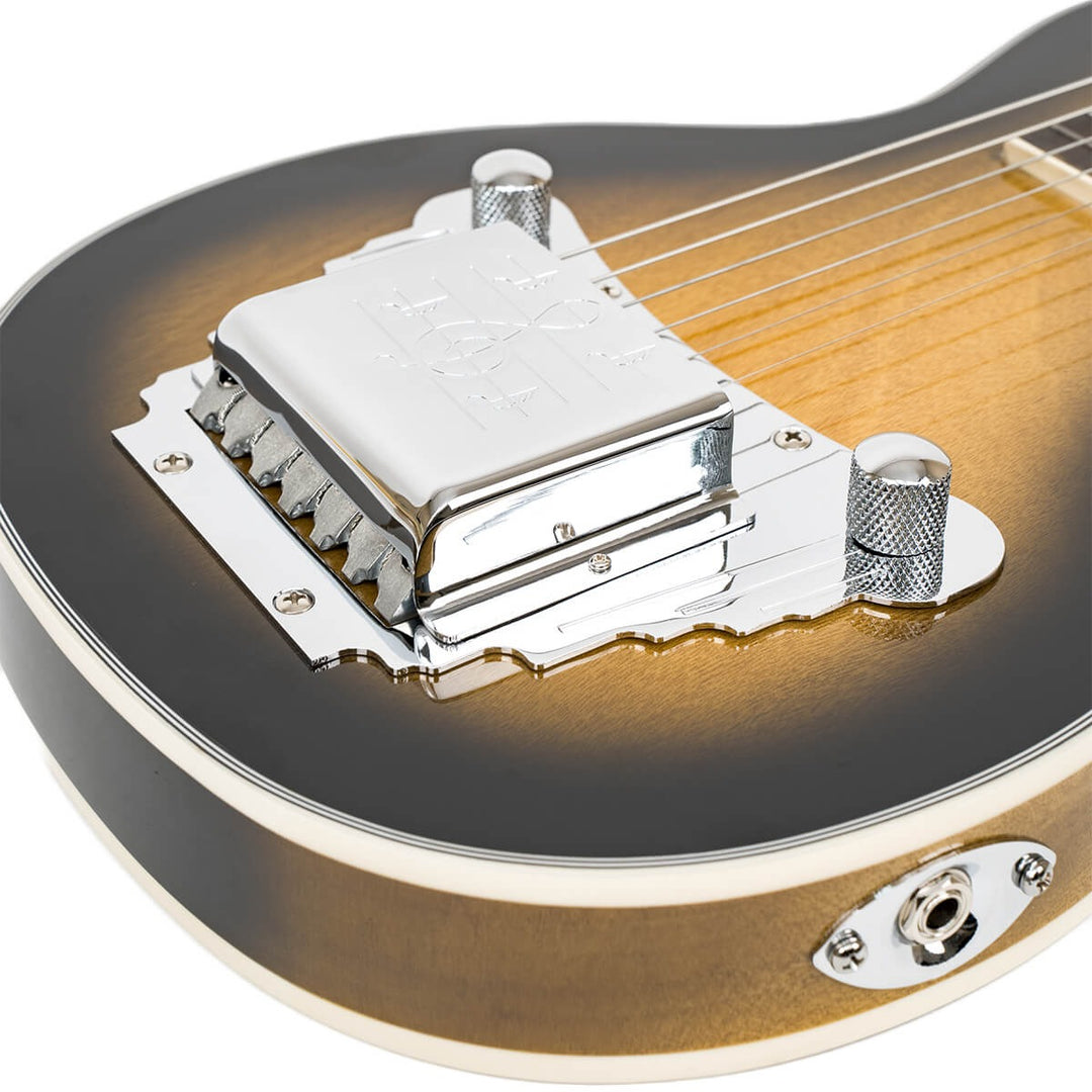 The Gold Tone LS-6 evokes the Oahu Tonemaster, one of the most revered lap steels of the 1950s. Our version is so close to the original that owners of Oahu instruments buy LS-6 pickups and hardware from us for use in the restoration of their prized guitars. The LS-6 is set up for open D tuning (DADF#AD) but other tunings can be accommodated by installing strings that are gauged for those tunings.