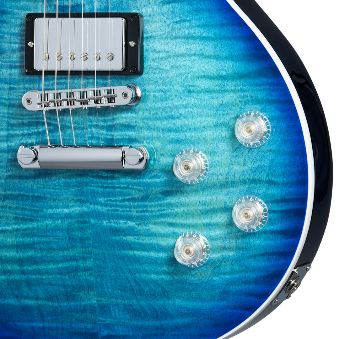 Gibson Les Paul Modern Figured. Ultra-Modern weight-relieved mahogany body with carved figured maple top. Asymmetrical SlimTaper mahogany neck. Compound radius ebony fretboard with 22 frets. Burstbucker Pro humbuckers with push/pull coil tap. Modern Contoured Heel for exceptional upper-fret access. Grover Rotomatic tuners. Includes hardshell case.