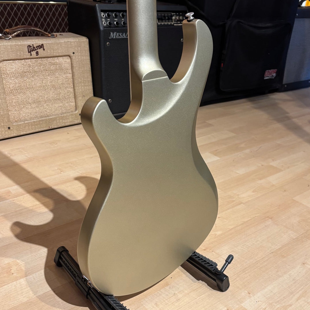 Gibson Victory, Gold Mist Satin. Reintroduced 80s-era cult-favorite solidbody electric. Mahogany body with refined contours. Explorer headstock. 25.5-inch scale SlimTaper mahogany neck, compound radius ebony fretboard, 24 medium jumbo frets. 80s Tribute humbuckers with push/pull master volume and tone controls for coil splitting. Tune-O-Matic bridge, Stop Bar tailpiece. Satin nitrocellulose lacquer finish. Includes hardshell case.