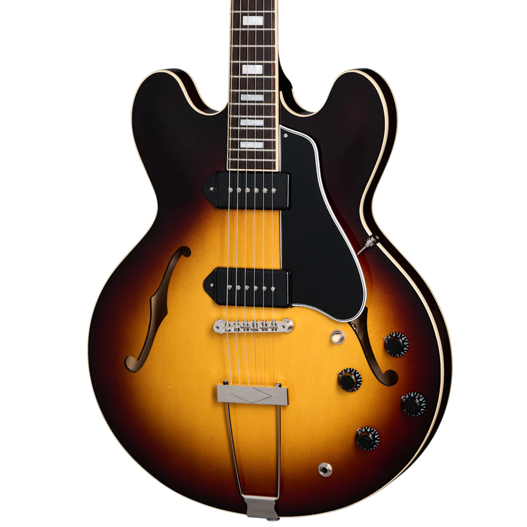 Gibson ES-330. Fully hollow thinline archtop body with no center block. Laminated maple top, back, and sides. Mahogany neck, rosewood fingerboard, 22 frets. P-90 dog-ear pickups. Trapeze tailpiece. Vintage styling. Includes hardshell case.