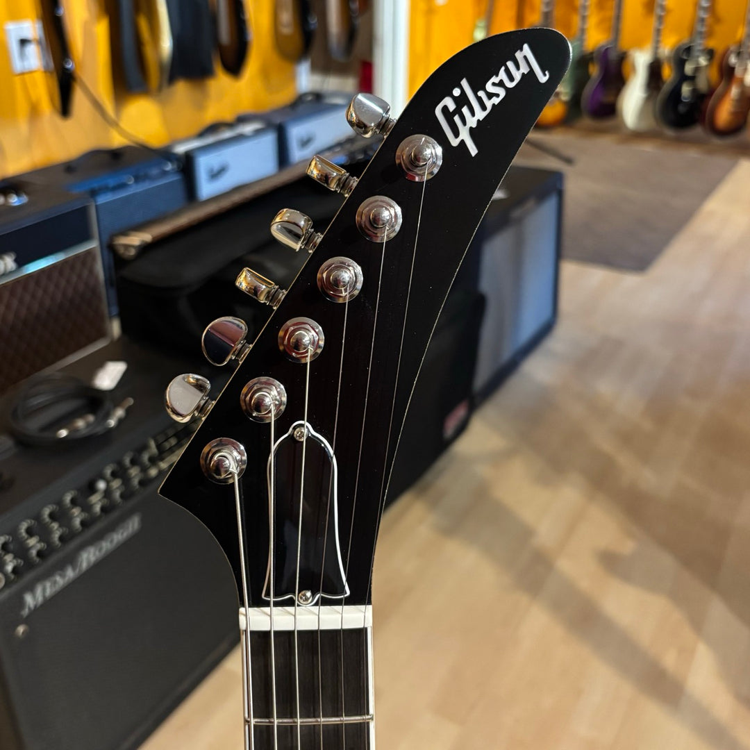 Gibson Victory, Gold Mist Satin. Reintroduced 80s-era cult-favorite solidbody electric. Mahogany body with refined contours. Explorer headstock. 25.5-inch scale SlimTaper mahogany neck, compound radius ebony fretboard, 24 medium jumbo frets. 80s Tribute humbuckers with push/pull master volume and tone controls for coil splitting. Tune-O-Matic bridge, Stop Bar tailpiece. Satin nitrocellulose lacquer finish. Includes hardshell case.