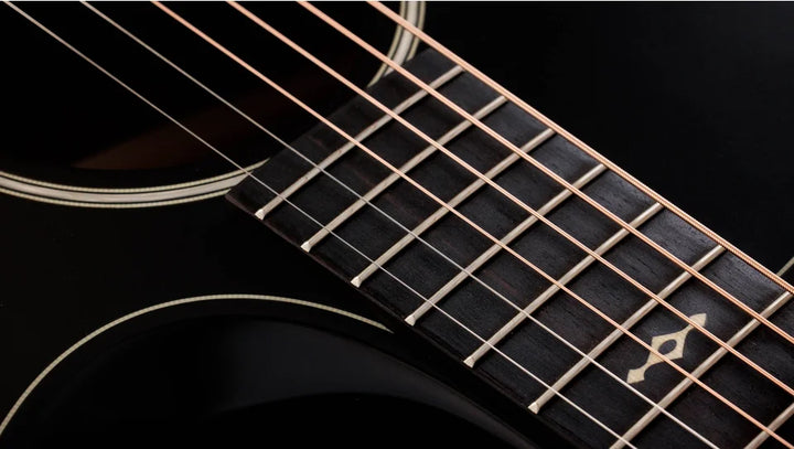 Overview

Solid sapele back and sides yield bold midrange voice
Mahogany top for warm, woody character
Scalloped V-Class bracing dramatically improves volume and sustain
Beveled armrest and cutaway offer seamless feel
Ships with Claria electronics and hardshell case