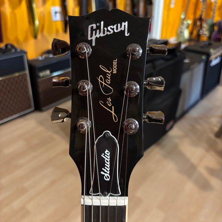 Gibson Les Paul Studio Modern. Ultra Modern weight-relieved mahogany body with maple cap. Modern Contoured Heel for exceptional upper-fret access. Mahogany neck with rounded profile. Compound radius bound ebony fretboard. 490R and 498T pickups with coil tapping, phase switching, and pure bypass. Black nickel hardware. Includes soft shell case.