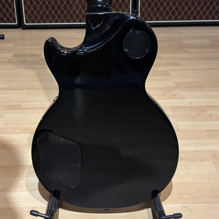 Gibson Les Paul Studio Modern. Ultra Modern weight-relieved mahogany body with maple cap. Modern Contoured Heel for exceptional upper-fret access. Mahogany neck with rounded profile. Compound radius bound ebony fretboard. 490R and 498T pickups with coil tapping, phase switching, and pure bypass. Black nickel hardware. Includes soft shell case.
