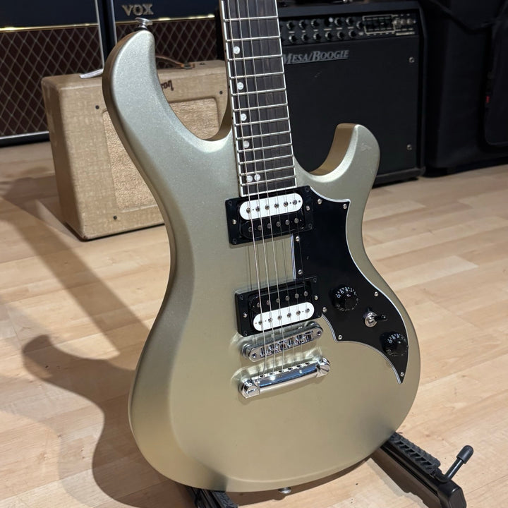 Gibson Victory, Gold Mist Satin. Reintroduced 80s-era cult-favorite solidbody electric. Mahogany body with refined contours. Explorer headstock. 25.5-inch scale SlimTaper mahogany neck, compound radius ebony fretboard, 24 medium jumbo frets. 80s Tribute humbuckers with push/pull master volume and tone controls for coil splitting. Tune-O-Matic bridge, Stop Bar tailpiece. Satin nitrocellulose lacquer finish. Includes hardshell case.