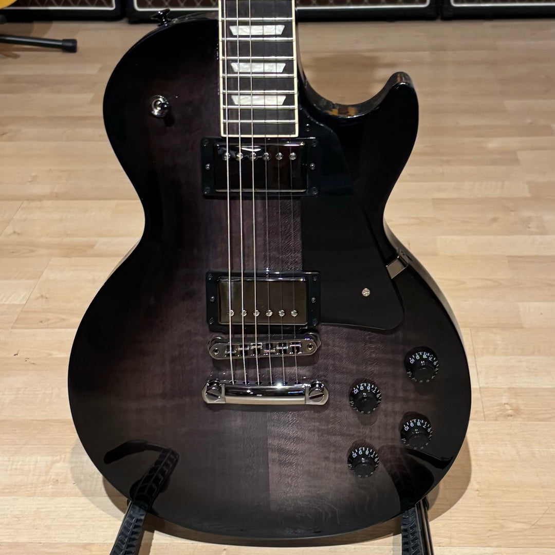 Gibson Les Paul Studio Modern. Ultra Modern weight-relieved mahogany body with maple cap. Modern Contoured Heel for exceptional upper-fret access. Mahogany neck with rounded profile. Compound radius bound ebony fretboard. 490R and 498T pickups with coil tapping, phase switching, and pure bypass. Black nickel hardware. Includes soft shell case.